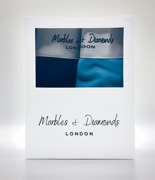 Essentials Pack retail box containing Obsidian and Larimar boxer briefs, Marbles & Diamonds London